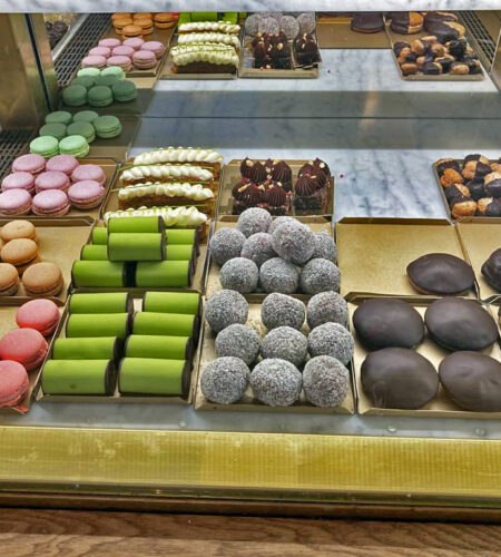 Some of the småkakor for sale at Tössebageriet, including traditional dammsugare, macarons in various flavours and colours, and biskvier.