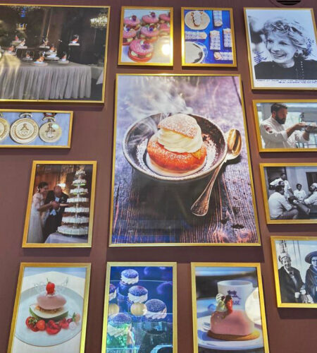 Photographs and paintings displayed on the wall at Tössebageriet. Some feature weddings and portraits; others some of their baked goods, including their famous semla.