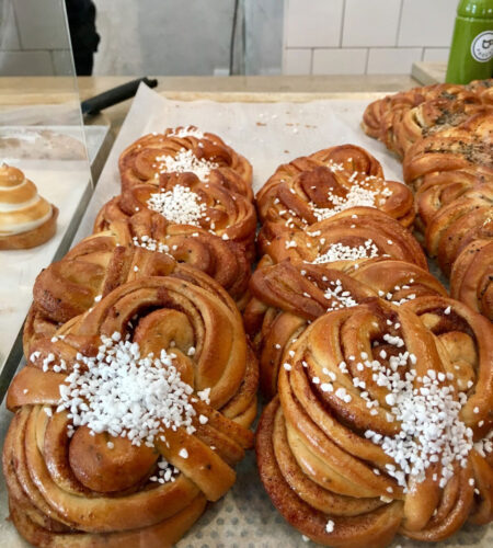 Cinnamon buns in a display case.