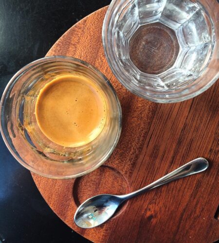 An espresso and a cup of water.